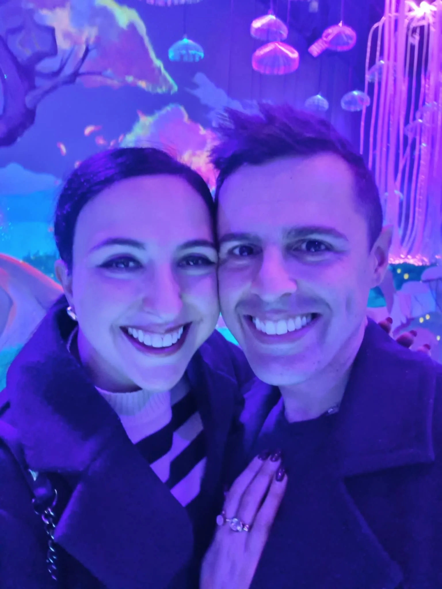 Elinor and Daniel on a date in a neon lit aquarium