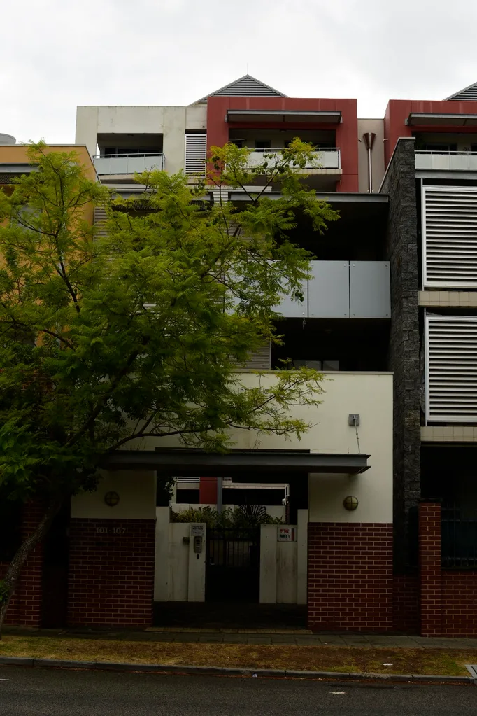 Margaret Mitchells redbrick appartment block with a leafy tree out the front