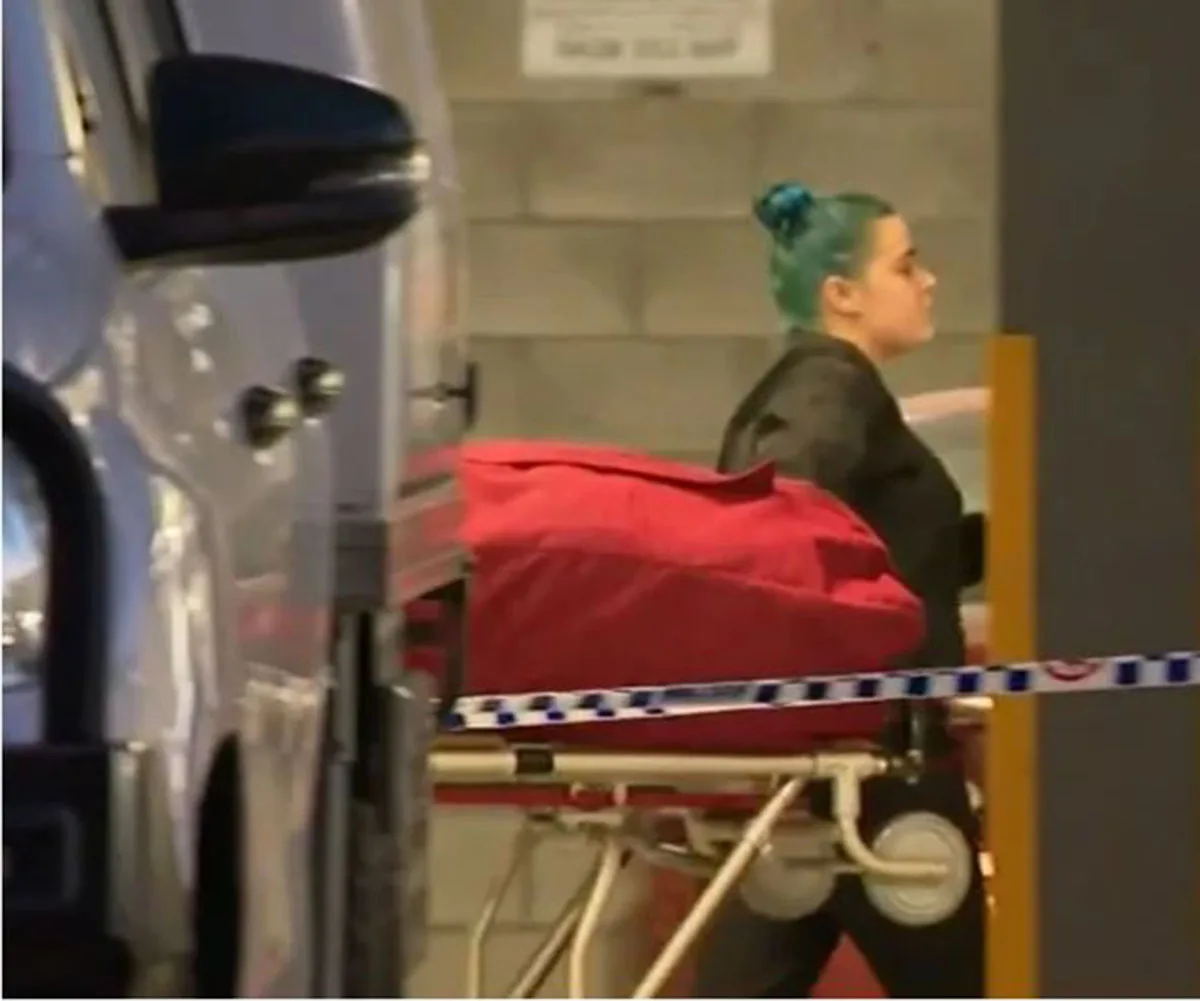 Tanya Glover’s body being removed from the scene. (Image: Channel 9)