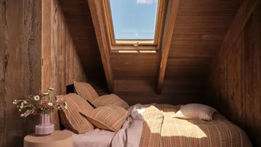 Linen House country collection in wooden cabin, cosy bed