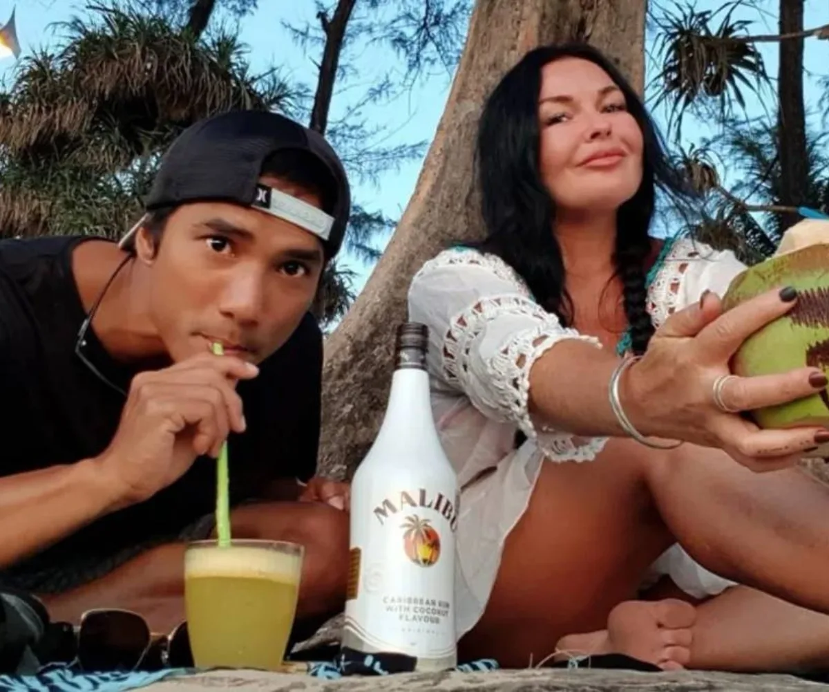 A man and woman relax on holiday.