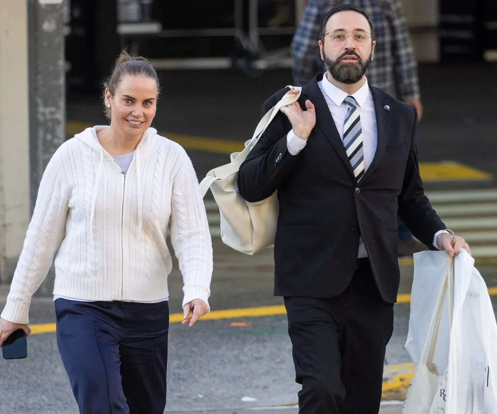 Jelena Dokic walks in the Melbourne airport carpark with her driver.