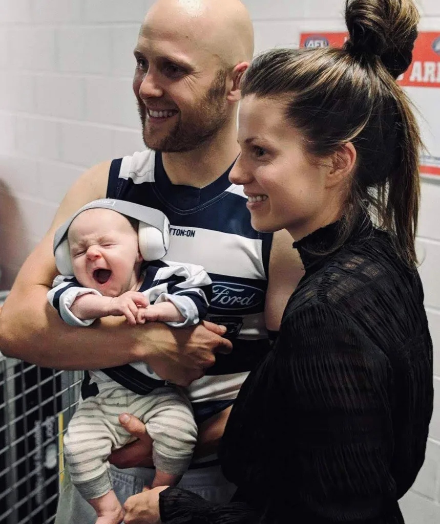 A man and woman and a tiny baby.