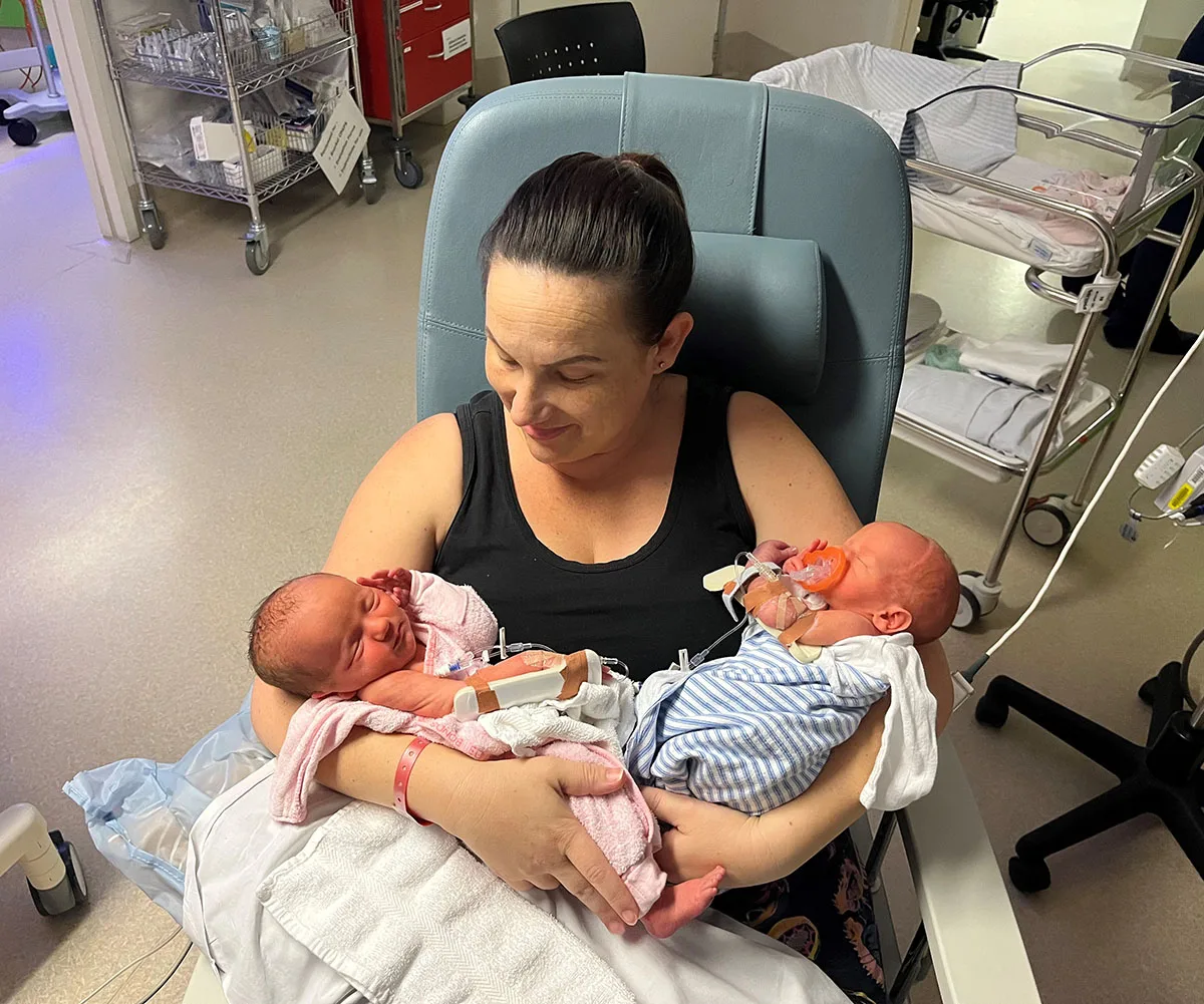Me with the newborn twins Poppy and Michael. (Image: Supplied)