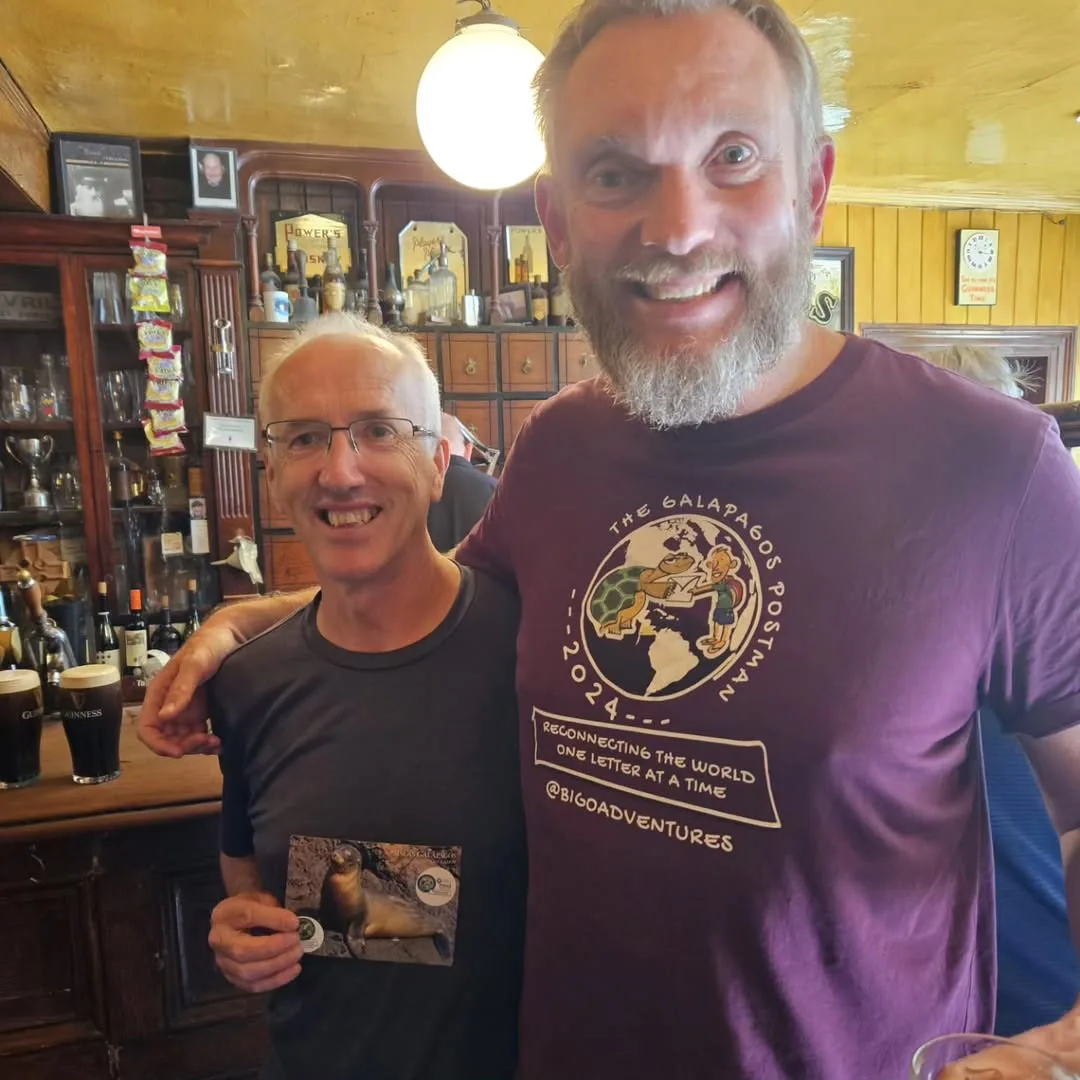 Jon Beardmore at the pub with Paddy, after delivering his postcard