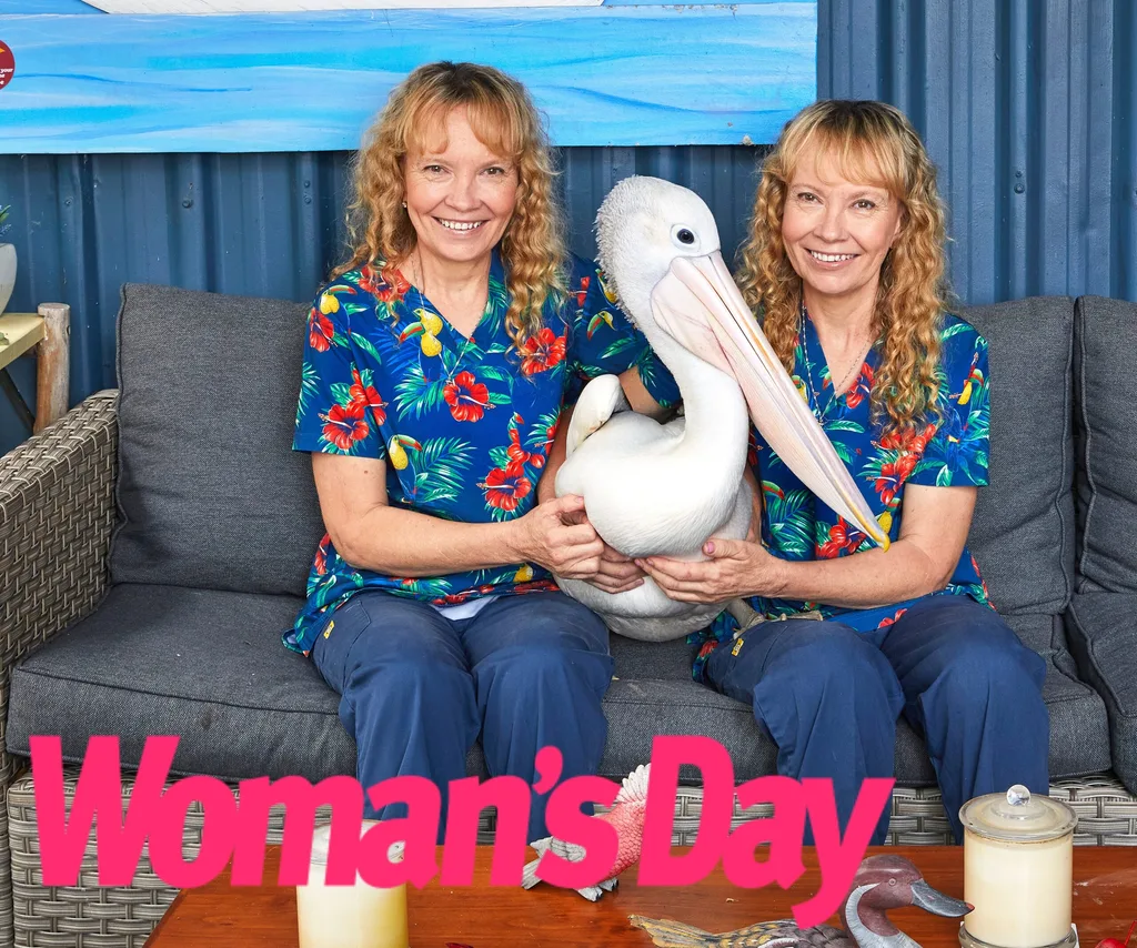 The Twinnies sit down on the couch with a pelican inbetween them.