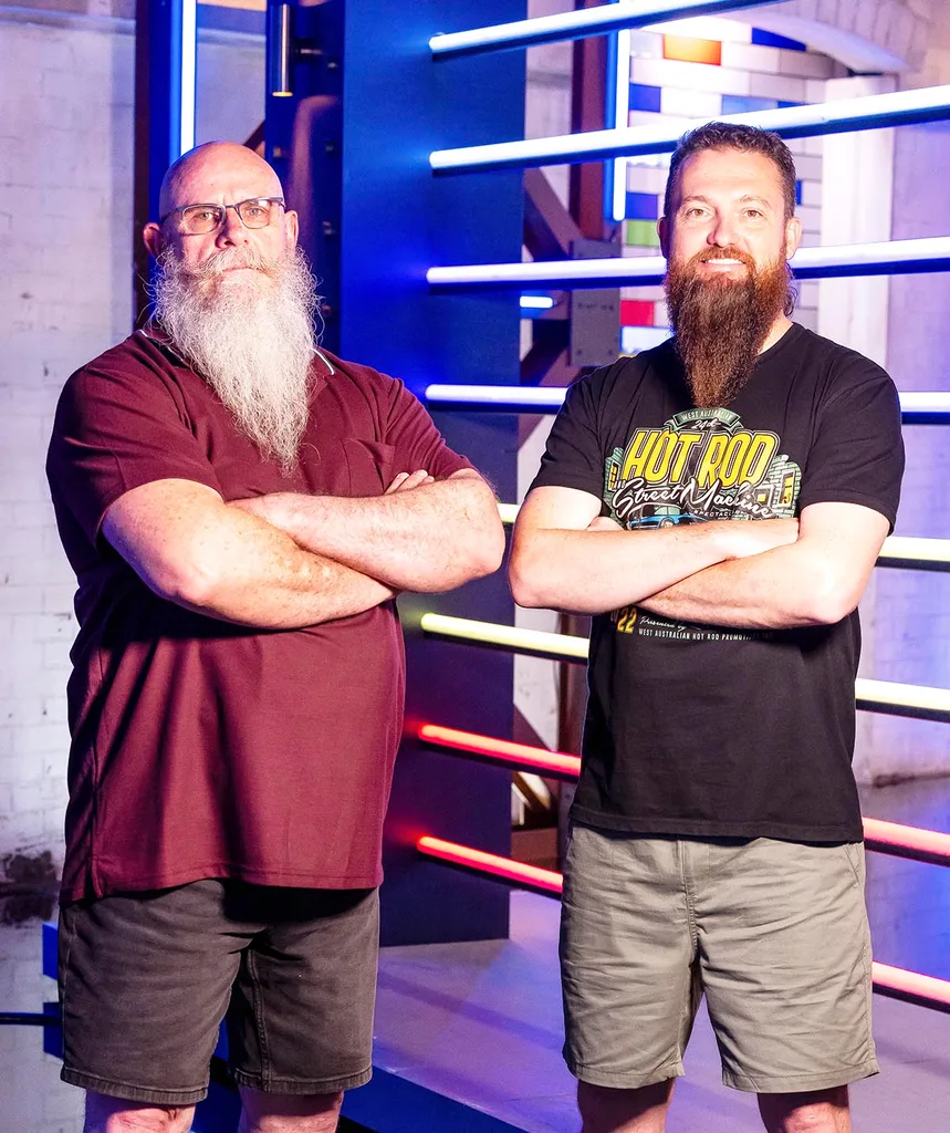 On left: G is pictured with arms crossed, burgundy t-shirt and brown shorts and his iconic long white beard. On right: David with his long red beard, black t-shirt that says 'Hot Rod' and beige shorts.
