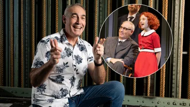 A man smiles at the camera and inset is an image of the same man in costume sitting in a wheelchair with a young girl and other man.