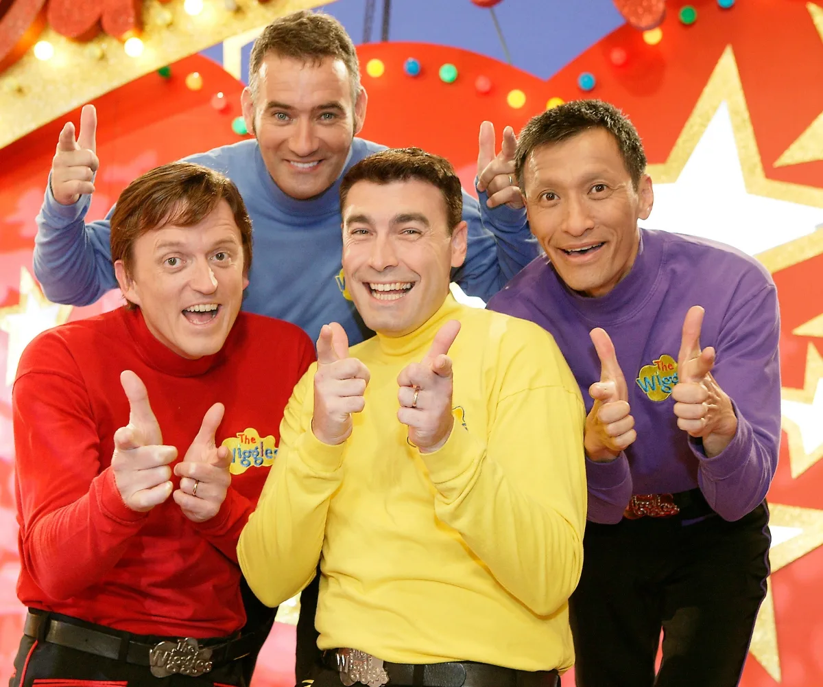 Four men in bright coloured tops.