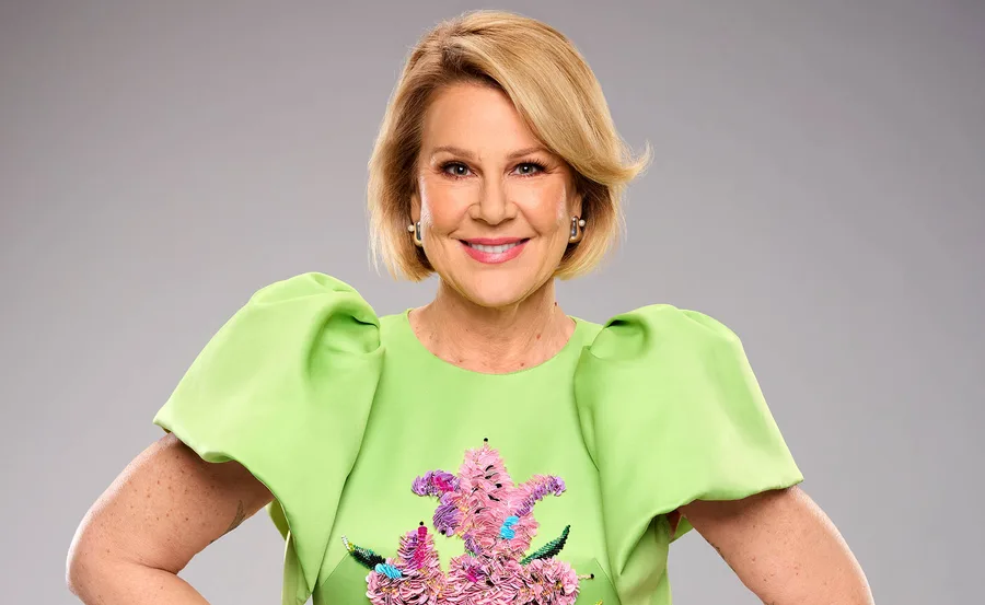 Julia Morris smiling in green dress