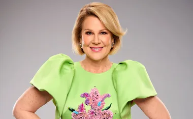 Julia Morris smiling in green dress