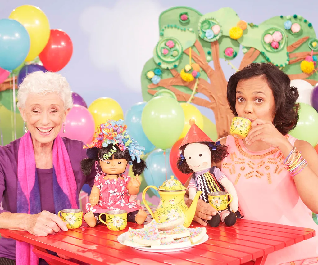 Benita Collings and Miranda Tapsell have a tea party with the dolls on Play School.