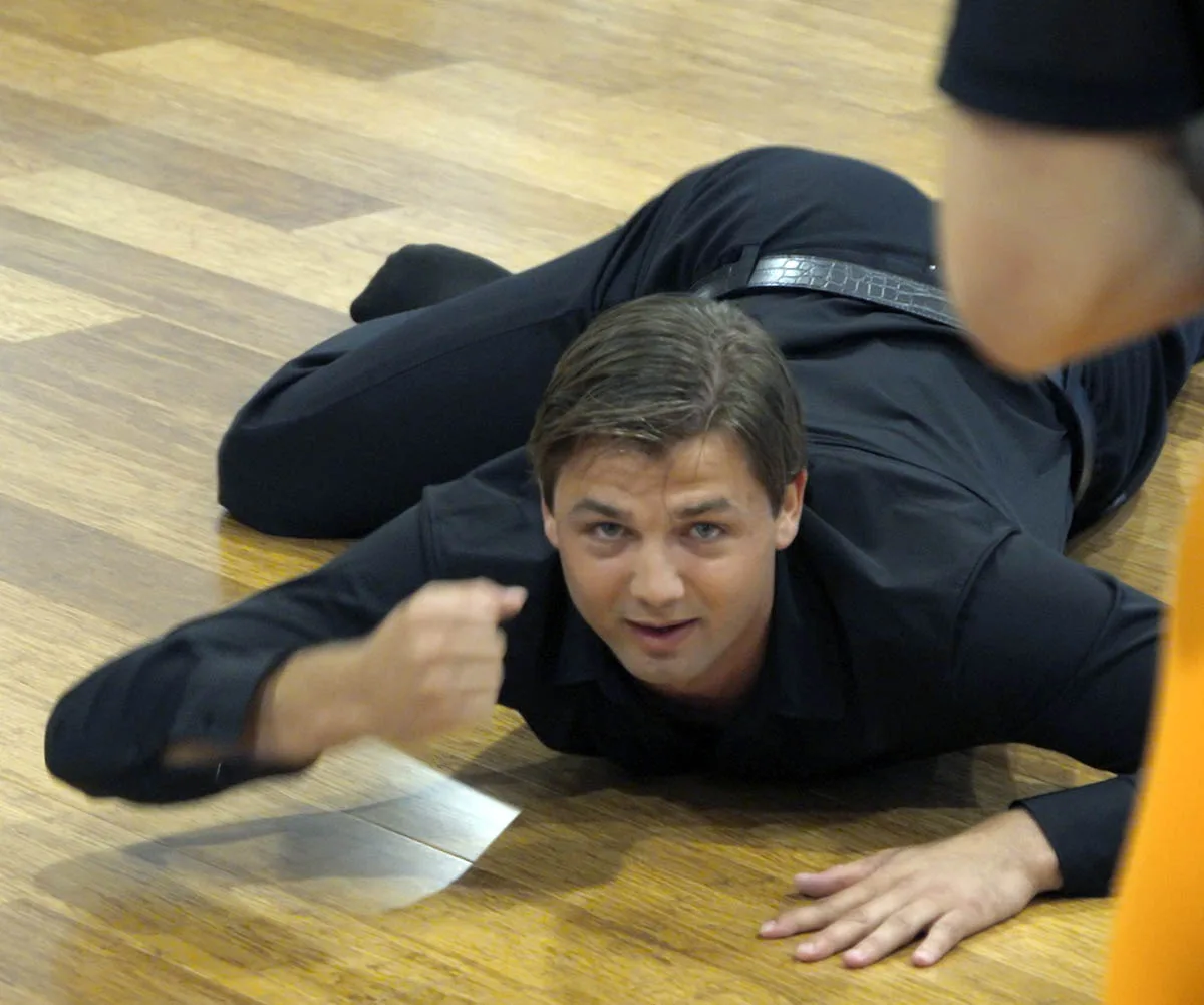 Liam does the "WAP" dance on a wooden floor in all black for a challenge