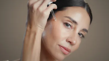woman applying serum