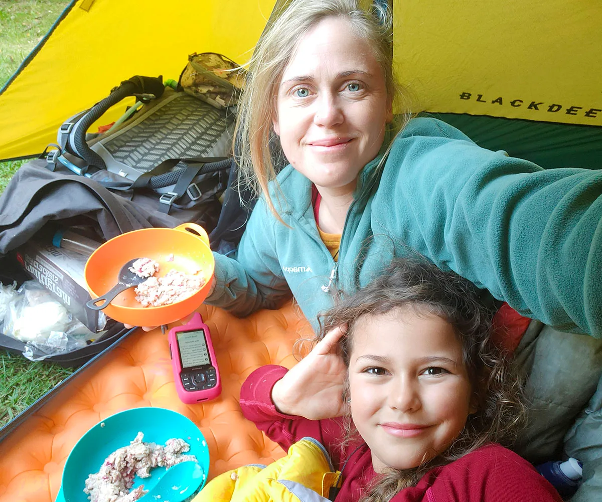 Emilie and I enjoying breakfast in our tent - the Little Yellow Motel. (Image: Supplied)