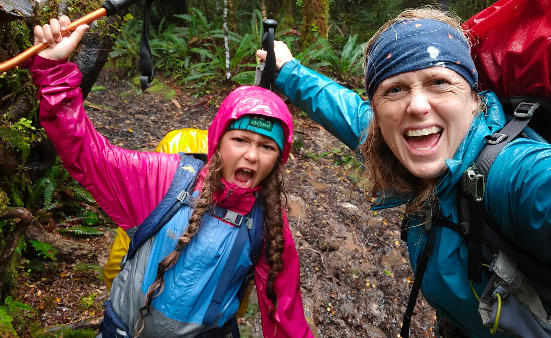 Emilie and Victoria fighting the mud monsters on their escape from Tararua Range. (Image: Supplied)