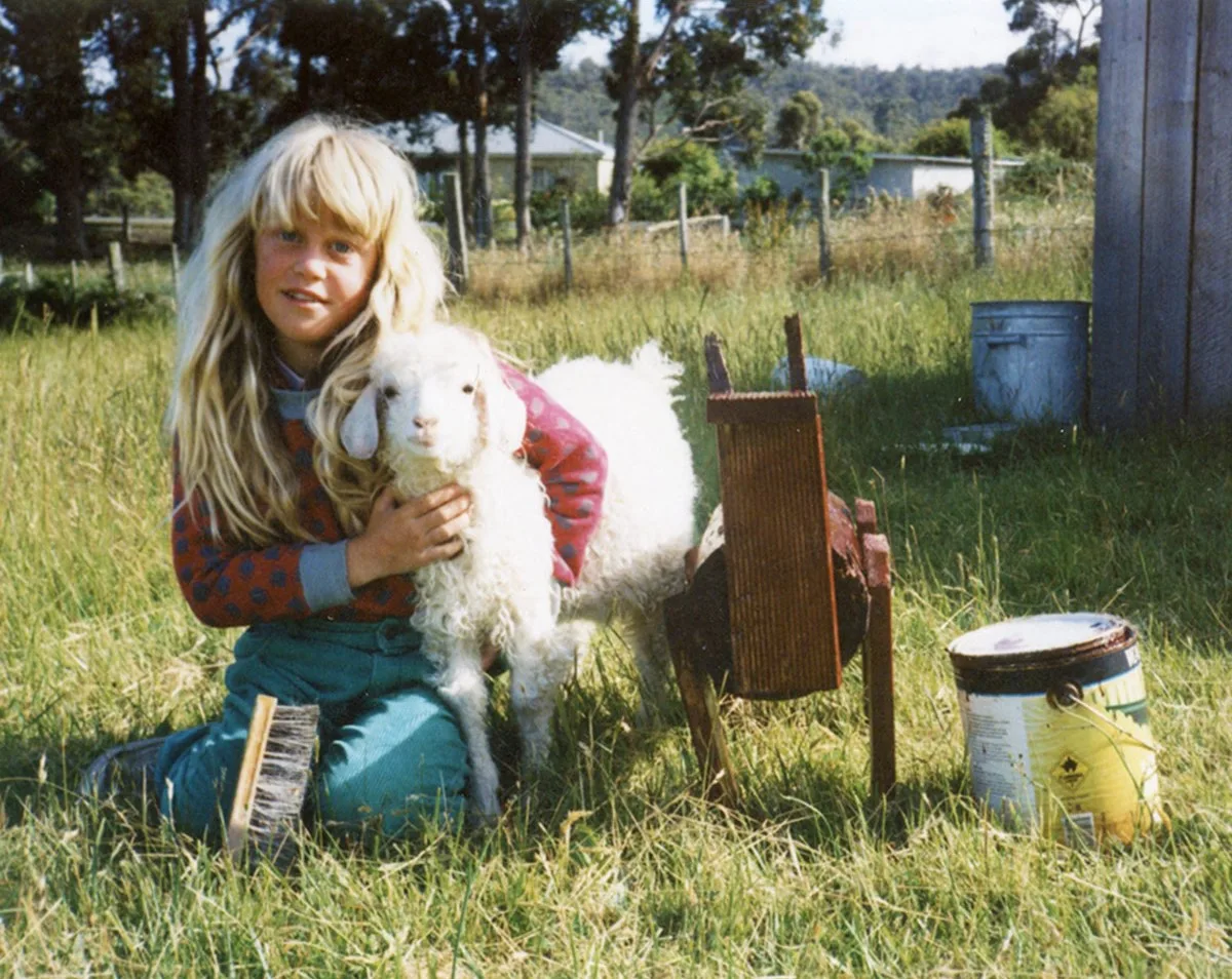 Me (aged seven) with my pet goat Suzie in Huonville, Tasmania. (Image: Supplied)