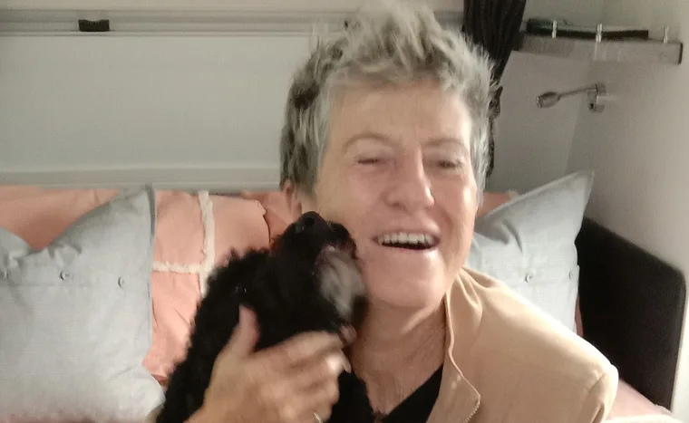 Jeanette Taylor in 2022 with a friends dog Beau. (Image: Supplied)