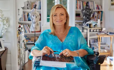 Carol Taylor wearing one of her own designs, ;Oceania’ is the name of the painting, printed on 100% silk. (Image: Supplied)