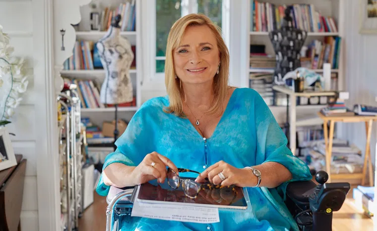 Carol Taylor wearing one of her own designs, ;Oceania’ is the name of the painting, printed on 100% silk. (Image: Supplied)