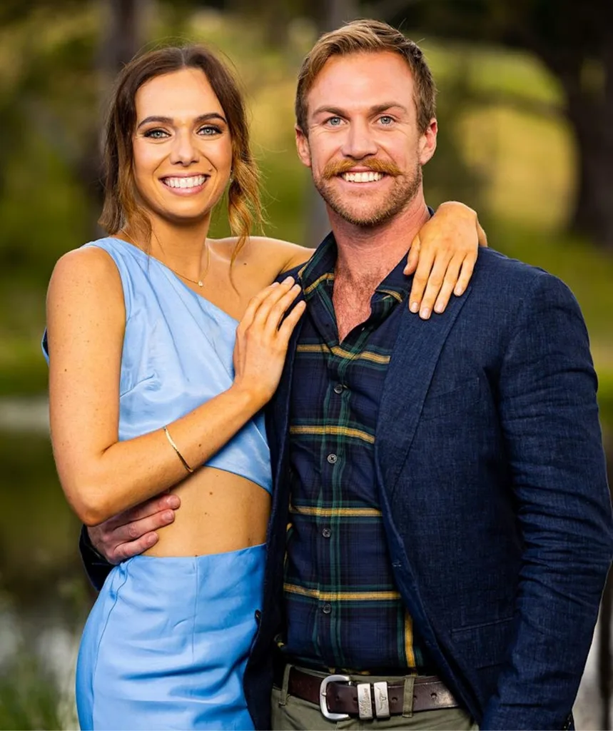 Farmer David and Emily pose together in a still from their season of Farmer Wants A Wife in 2023
