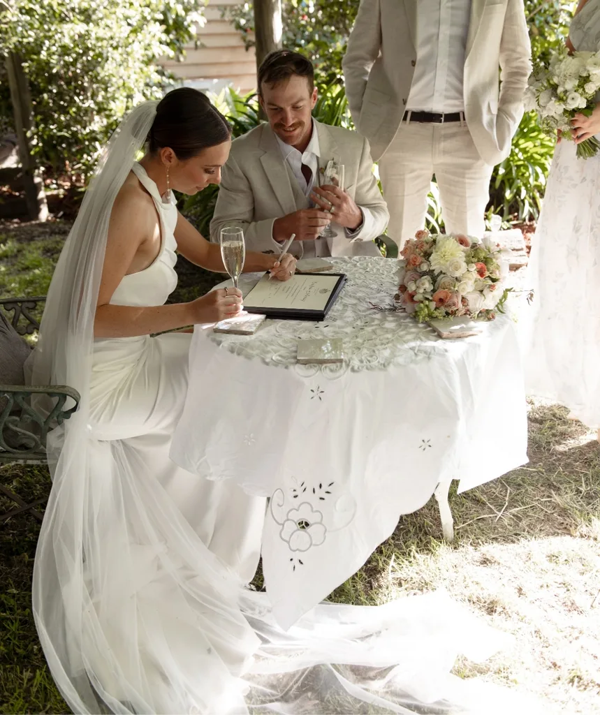 Farmer David and Emily sign the official documents are delivering their vows.