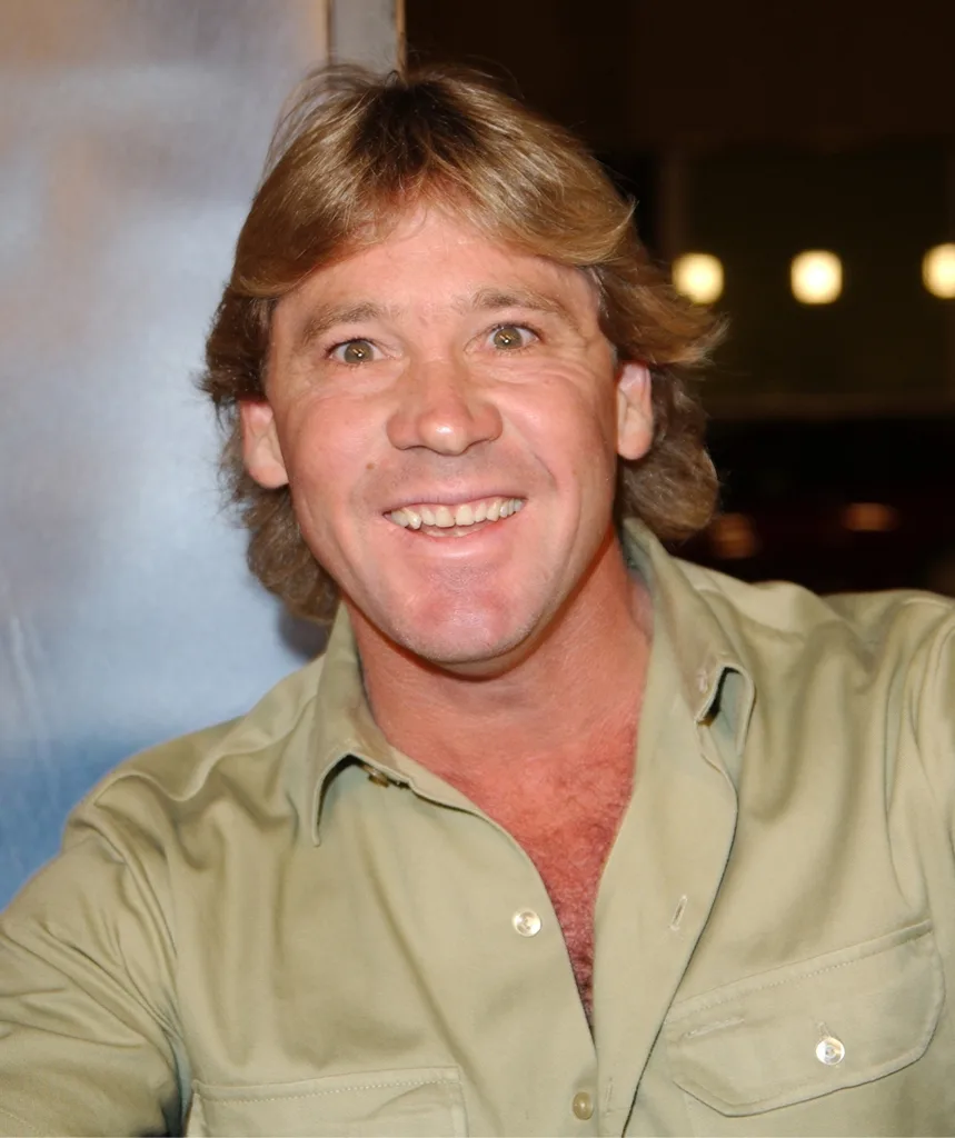 A man wearing khaki and smiling.