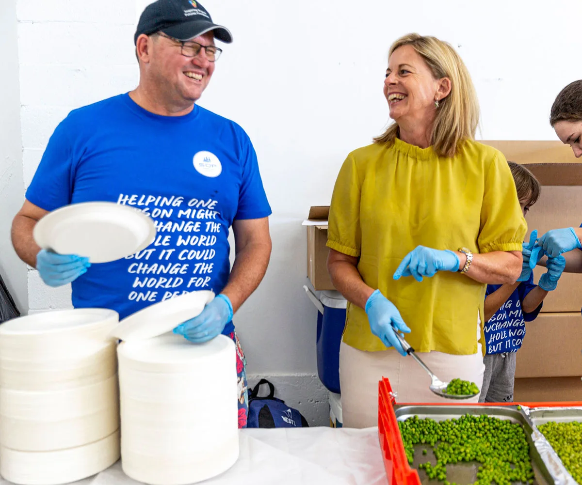 Serving Our People volunteers with Federal Member for Moncrieff, Angie Bell at Serving Our People's Christams lunch, December 2022. (Image: Supplied)