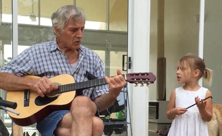 Holly's dad Gerry and daughter Sofia singing and playing ‘You are my sunshine’. (Image: Supplied)