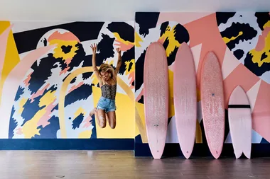 Pepa Ivanoff in Tamarindo, Costa Rica, painting a mural