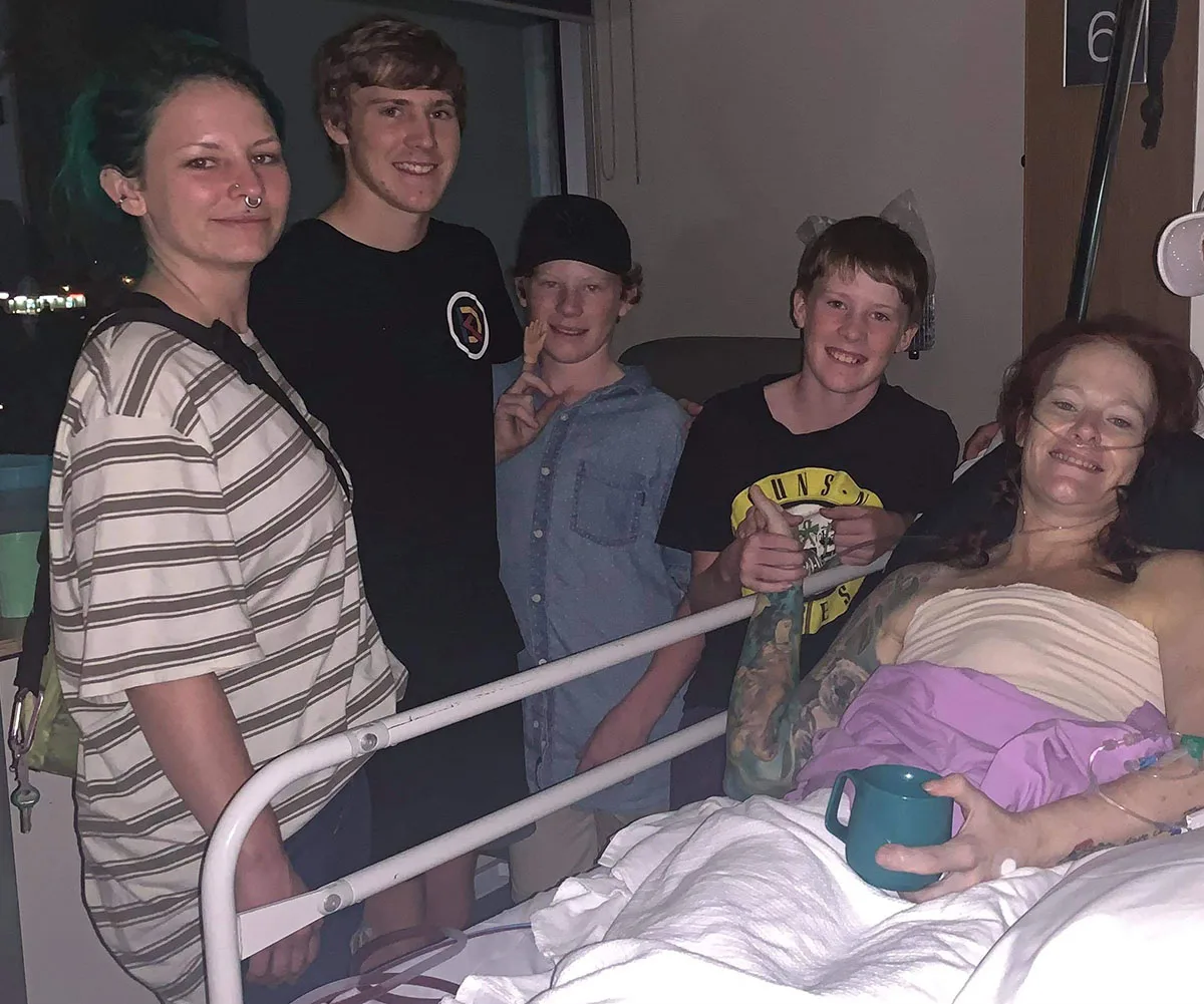 Me and my kids. Sarah-Jade and my sons, Sam, Tom, and Joe on the night I had my mastectomy. (Image: Supplied)