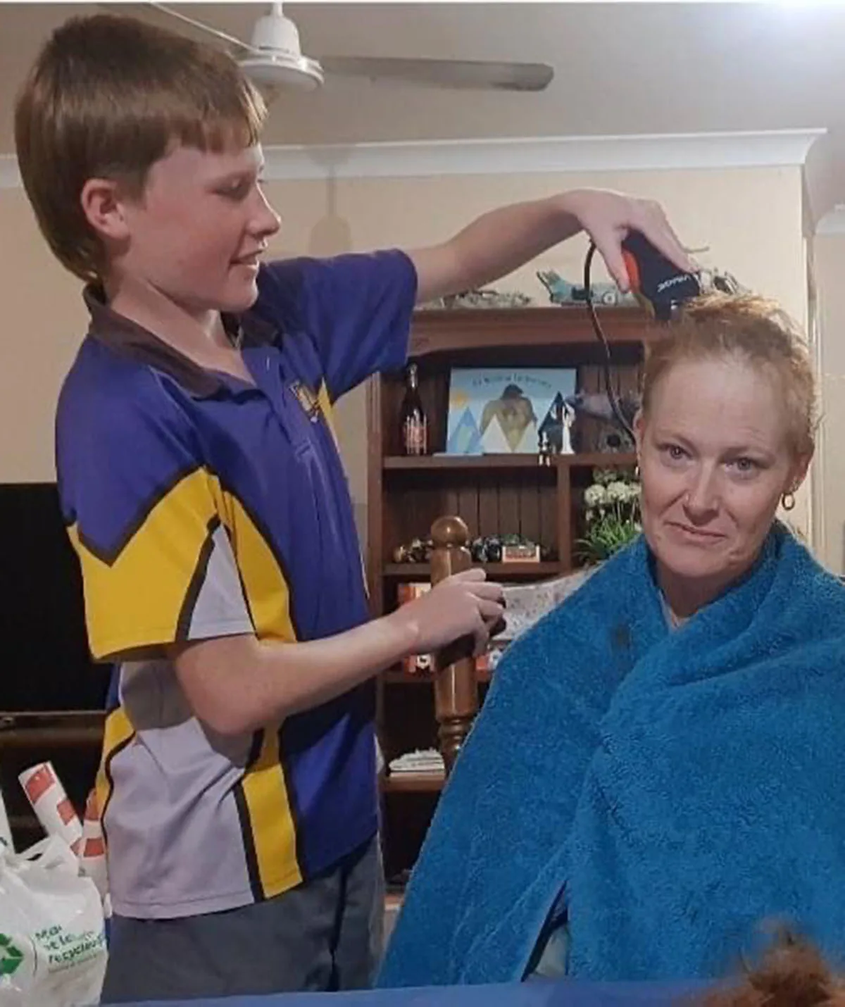 Joe shaving my hair - day 17 post starting chemo. (Image: Supplied)