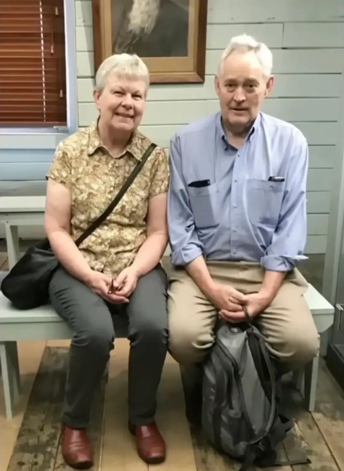 A man and woman smile.