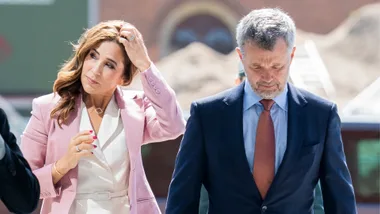 Queen Mary and Prince Frederik walking next to each other.