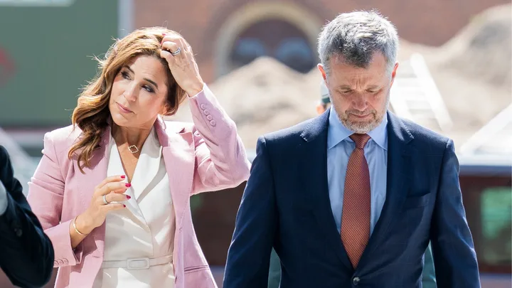 Queen Mary and Prince Frederik walking next to each other.