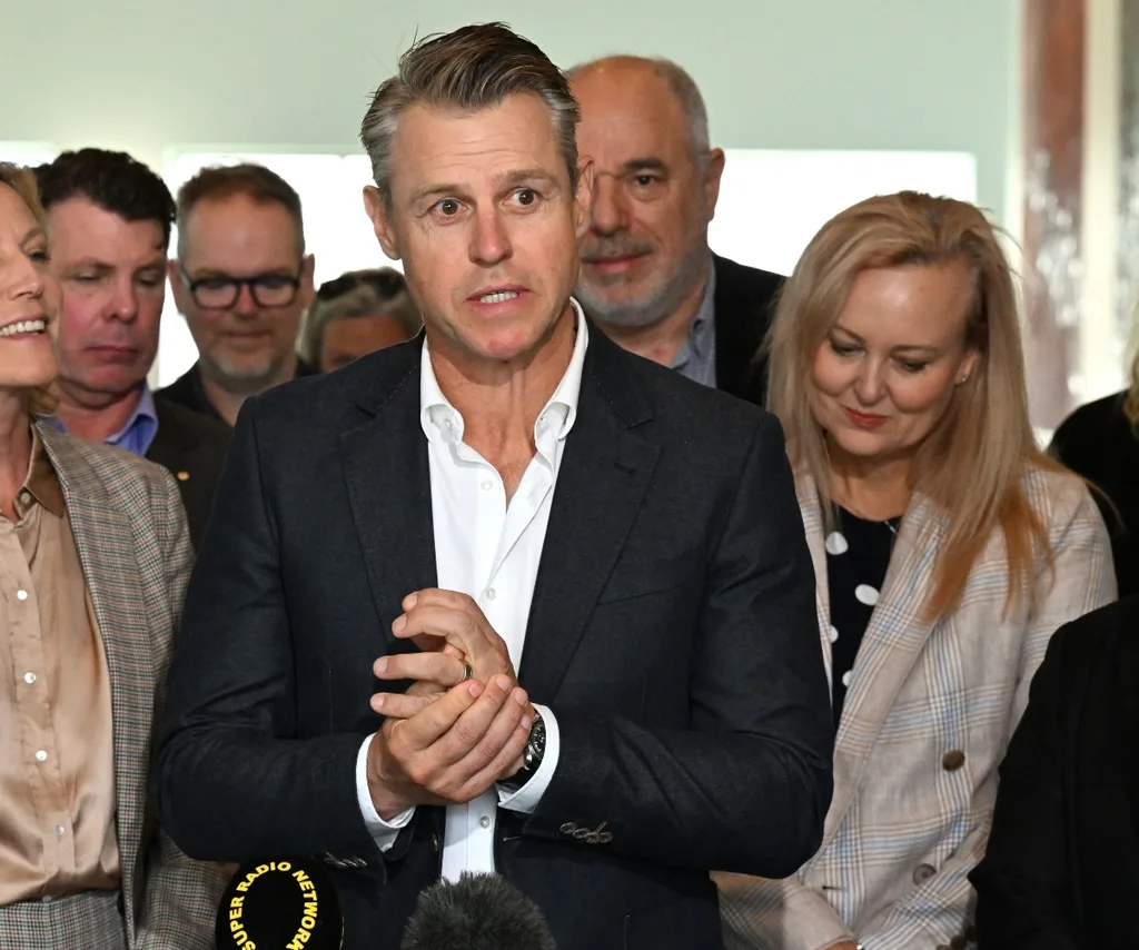 Rodger Corser is seen wearing a suit exiting a building