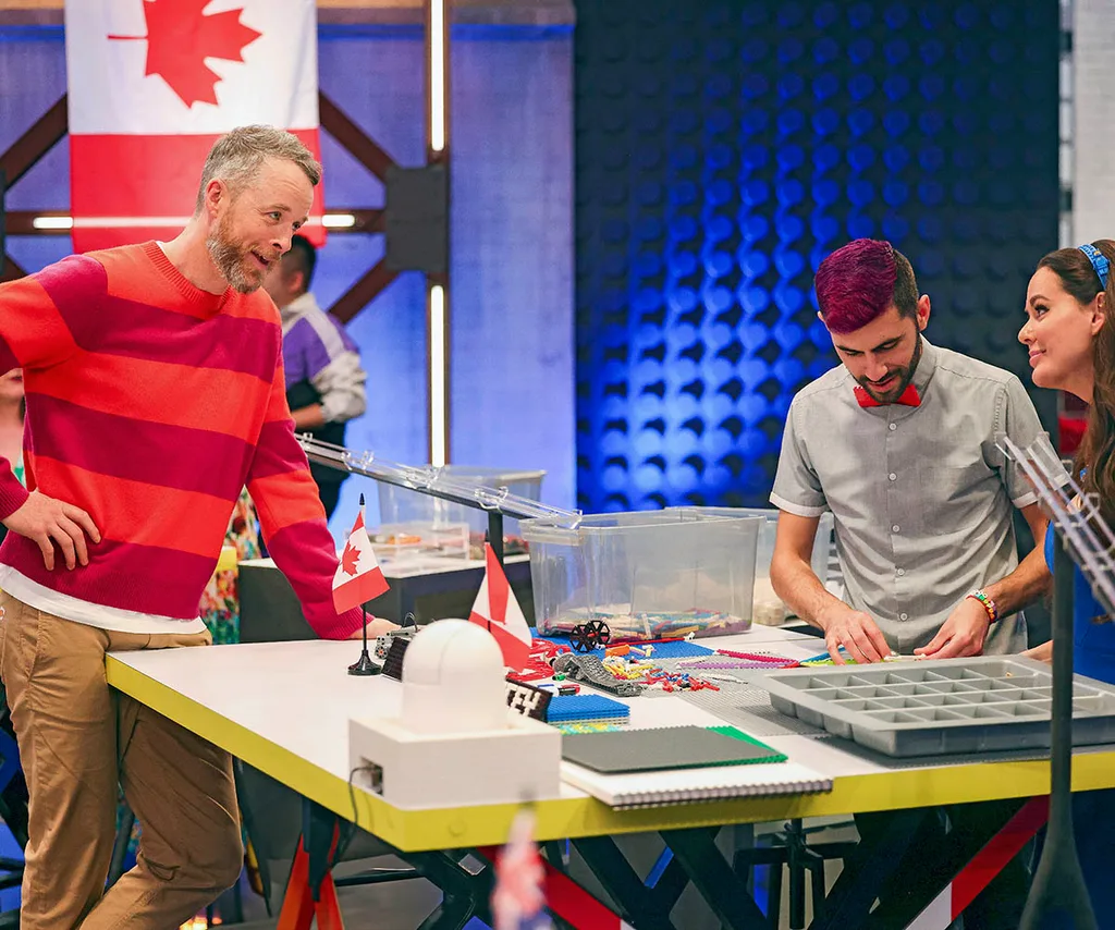 Hamish helps Team Canada as they work on a LEGO build on set of LEGO Masters 2025.