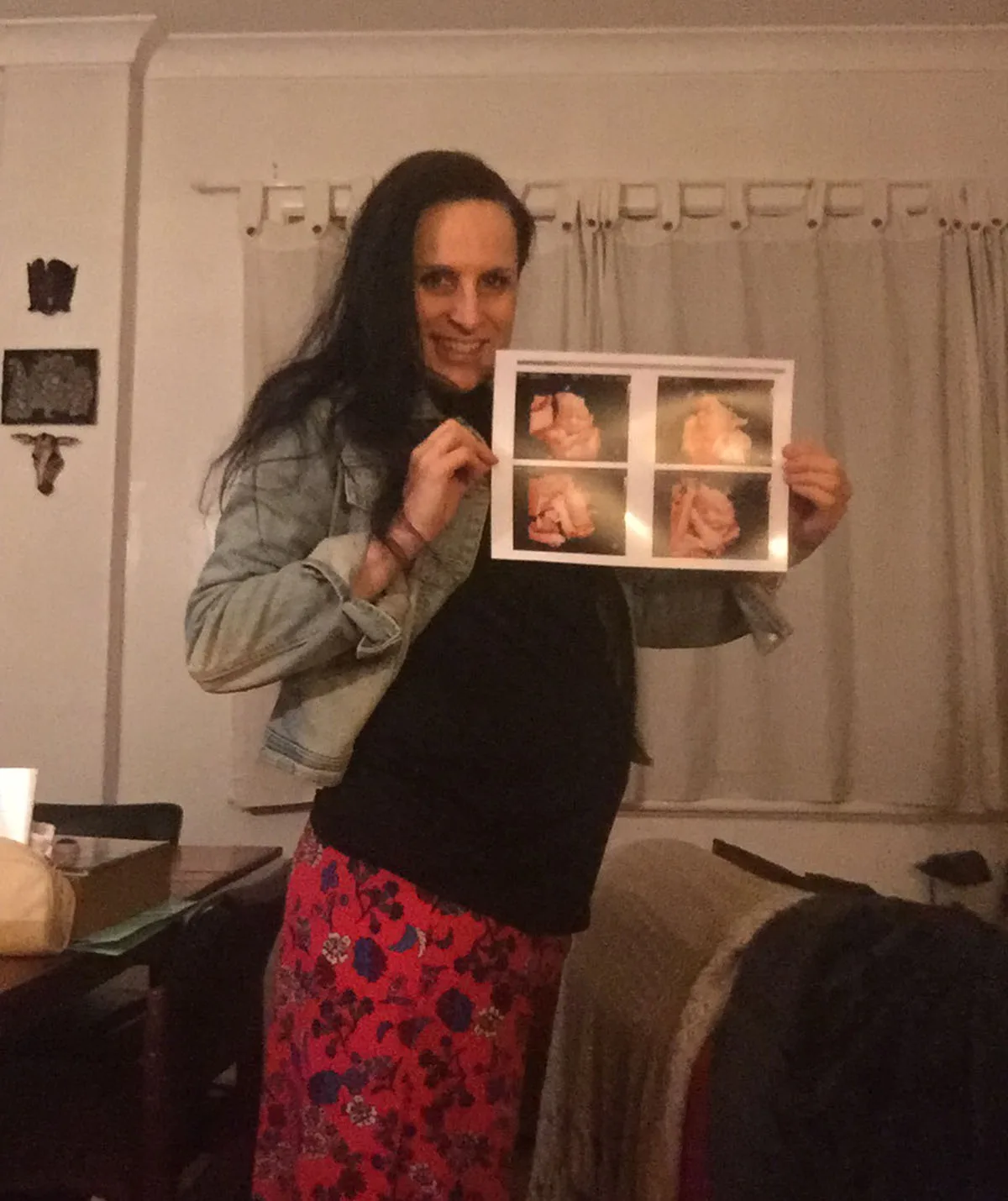 Me 8 months pregnant holding ultrasound photos. (Image: Supplied)