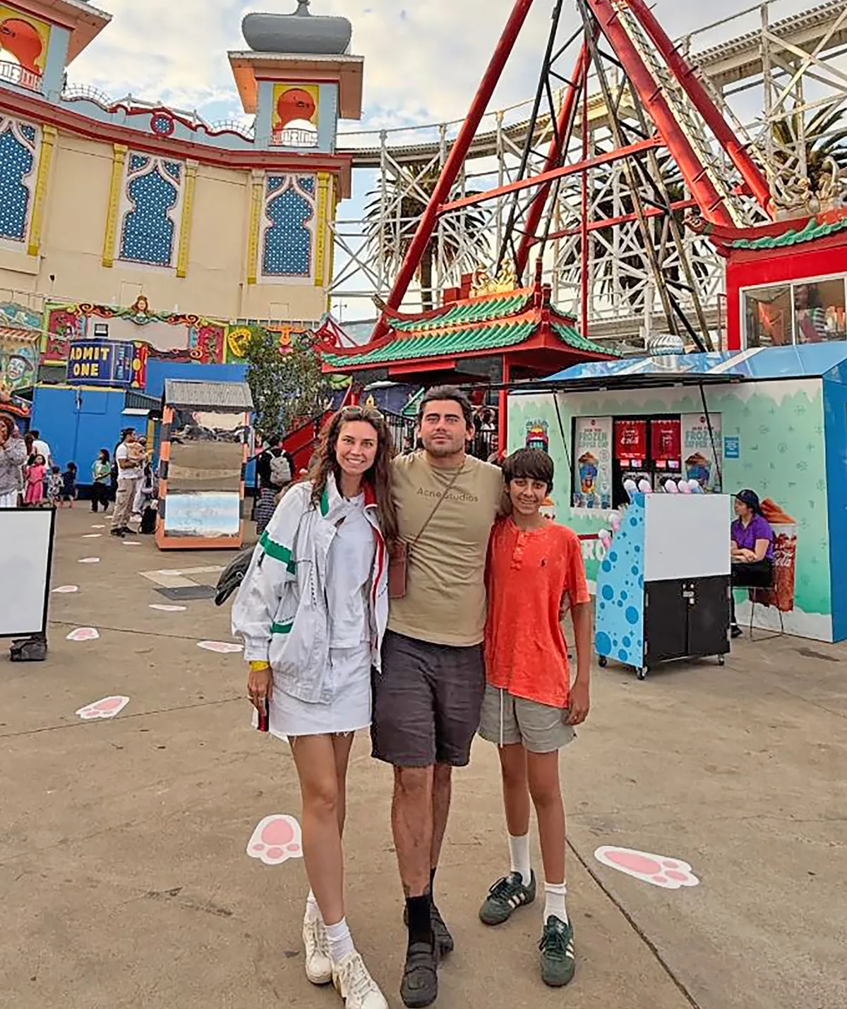 Sarah, Declan and Phoenix pose for a photo as they travel on a holiday.