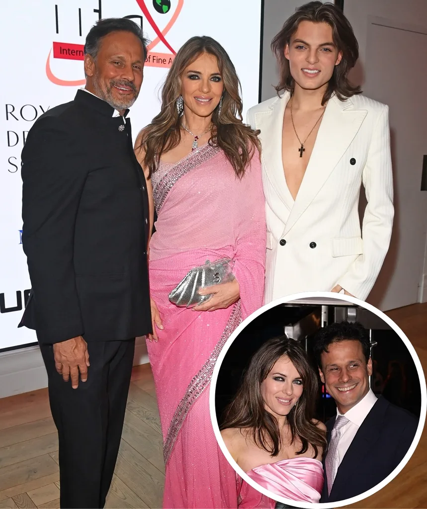 Liz poses with her ex husband Arun and son Damien