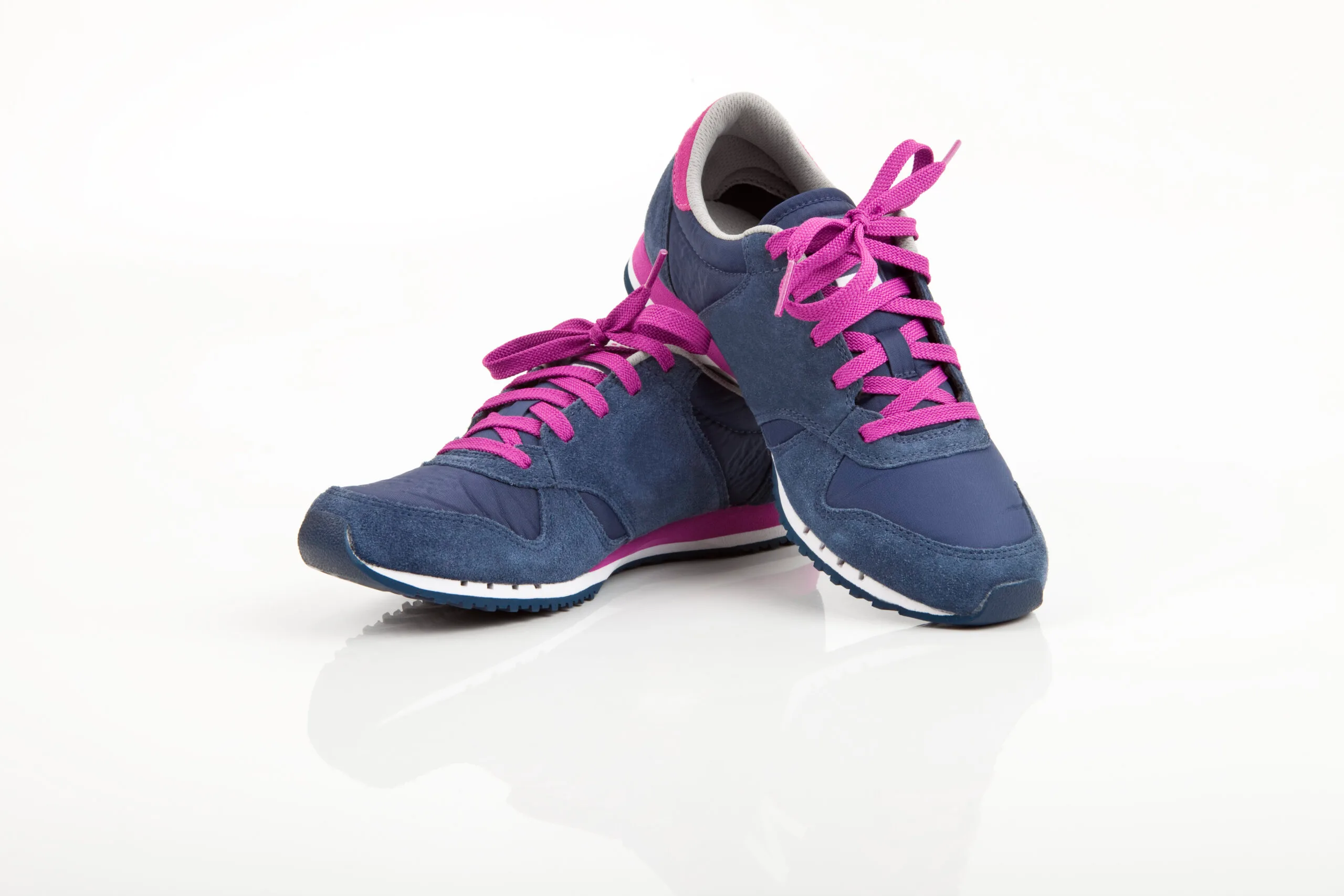 Lace; White Background; Strap; Sports Race; Fashion; No People; Females; Two Objects; Runs; Sports Footwear; Comfortable; Sports Training; Single Object; Remote; Health Club; Tied Up; Shoelace; Color Image; Walking; Marathon; Exercising; Healthy Lifestyle; Competition; Cross Shape; Pink Color; Blue; Rubber; Suede; Modern; New; On Top Of; Pair; Sport; Social Issues; Lifestyles; Studio Shot; Close-up; Front View; Equipment; Sports Shoe; Sports Equipment; Personal Accessory; Shoe; Clothing; Body Concious; Isolated; Isolated On White; Overlapping; Navy Blue; 