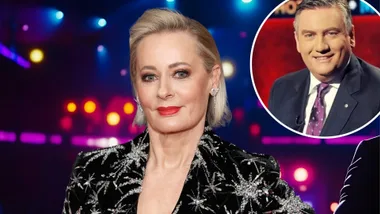 A woman and a man smile to camera.