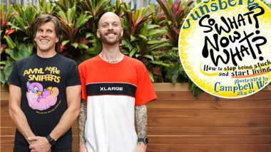 Two men smiling