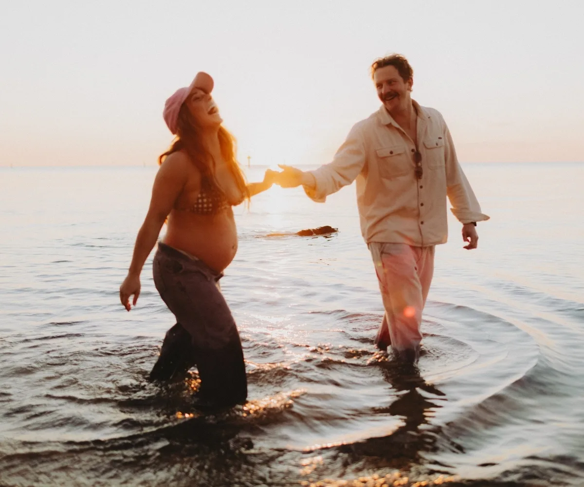 Emma, Ben and bump enjoy a sunset splash
