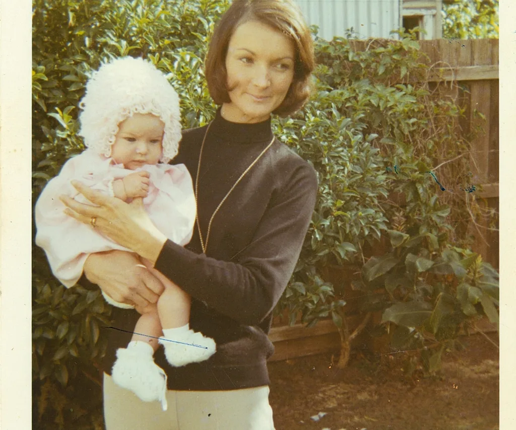 A woman holds a baby