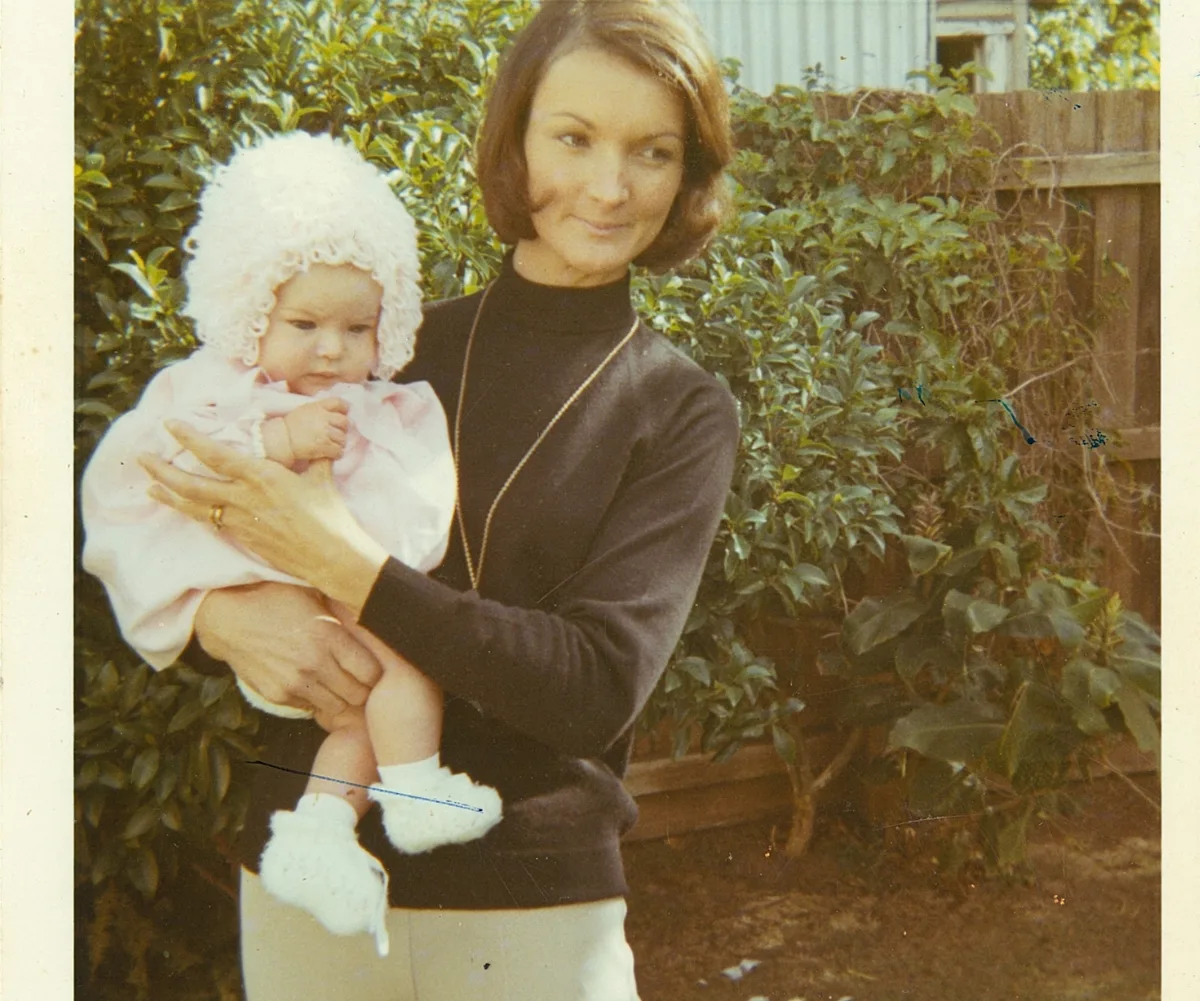 A woman holds a baby