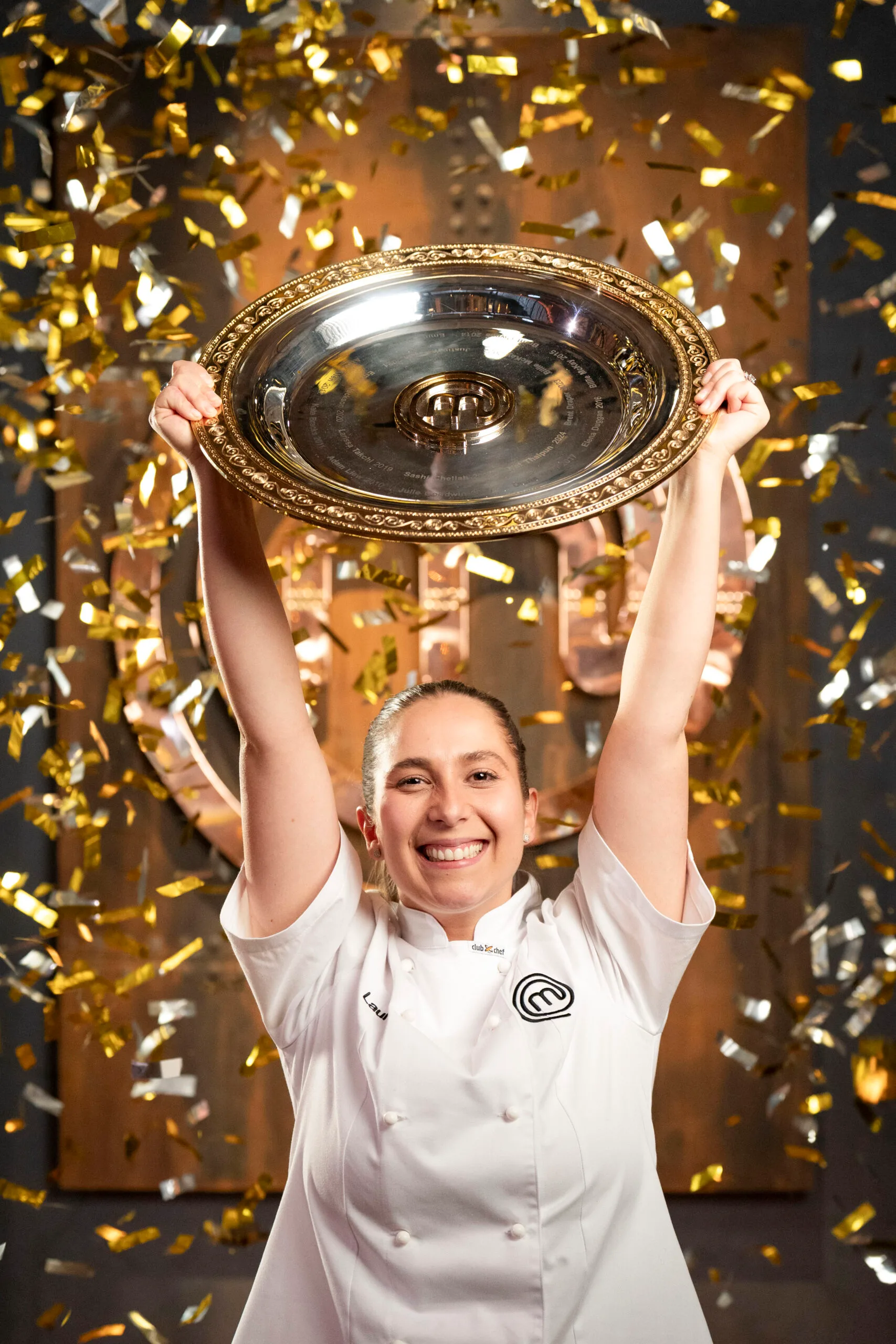 Laura Sharrad holds up the MasterChef Australia trophy after her glorious win.