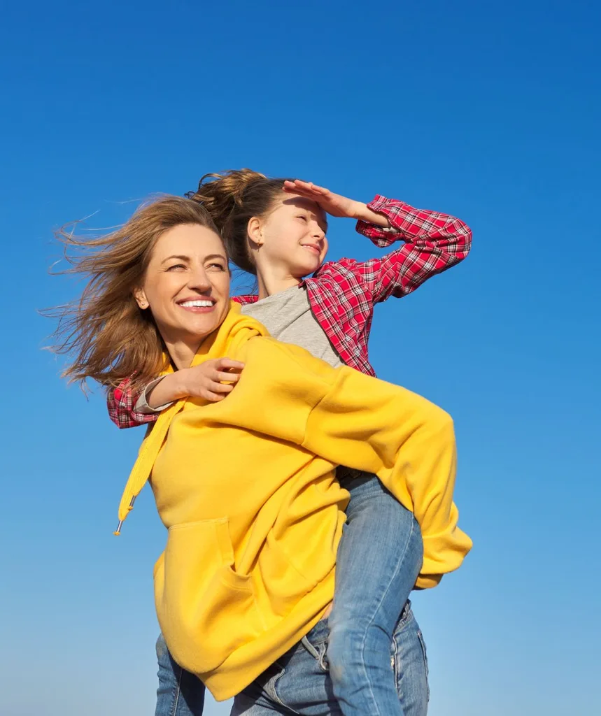 Woman carrying daughter
