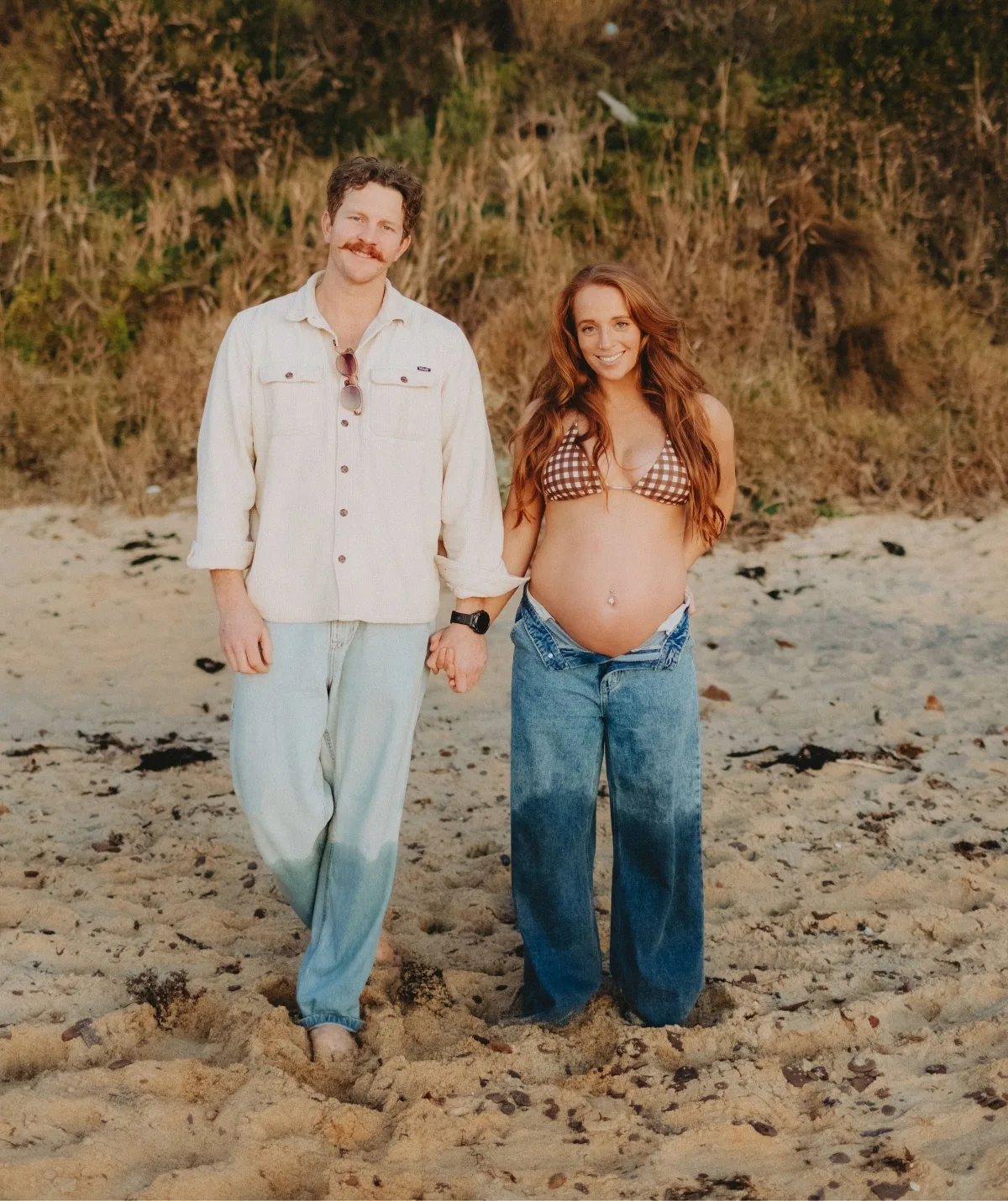 Ben and Emma standing in wet jeans