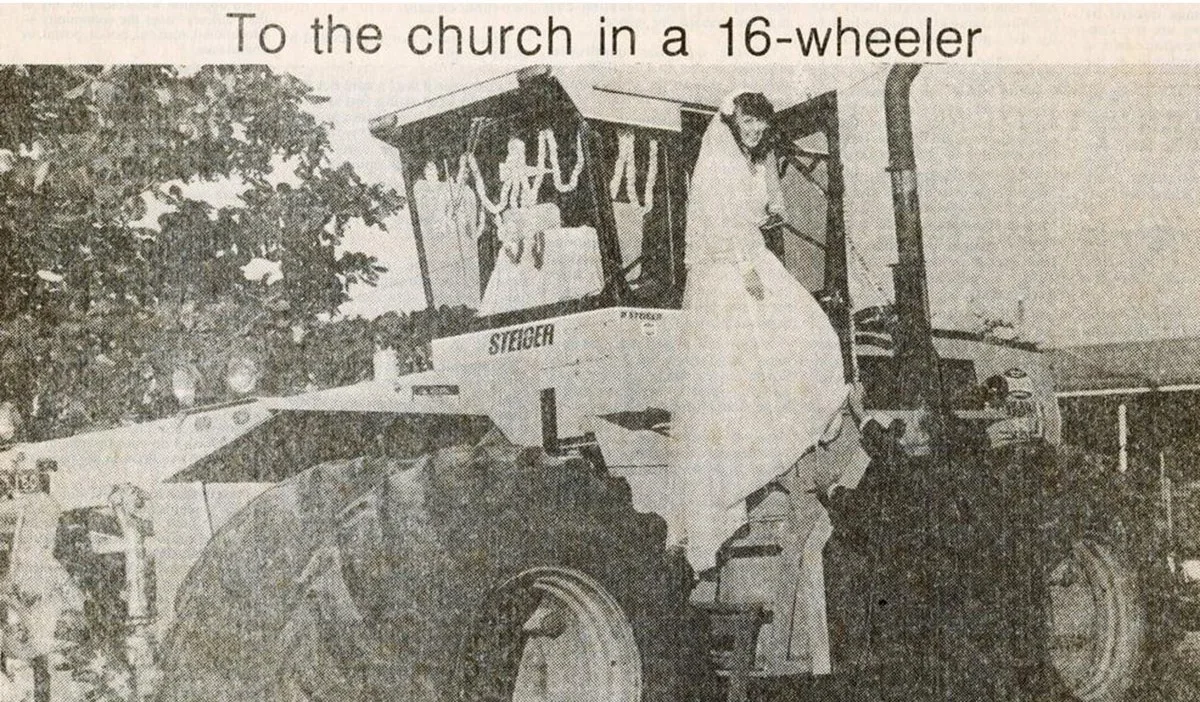 My grandmother, Gail Quin, stepping down from a Steiger 8 wheel tractor with the help of her father Vince Quin on her wedding day on June 27, 1981. Gail Quin was married to Warren Jonsson at Our Lady Help of Christian church, Earlville, with a convoy of tractors escorting the bride, groom and bridal party to the church. (Image: Supplied)